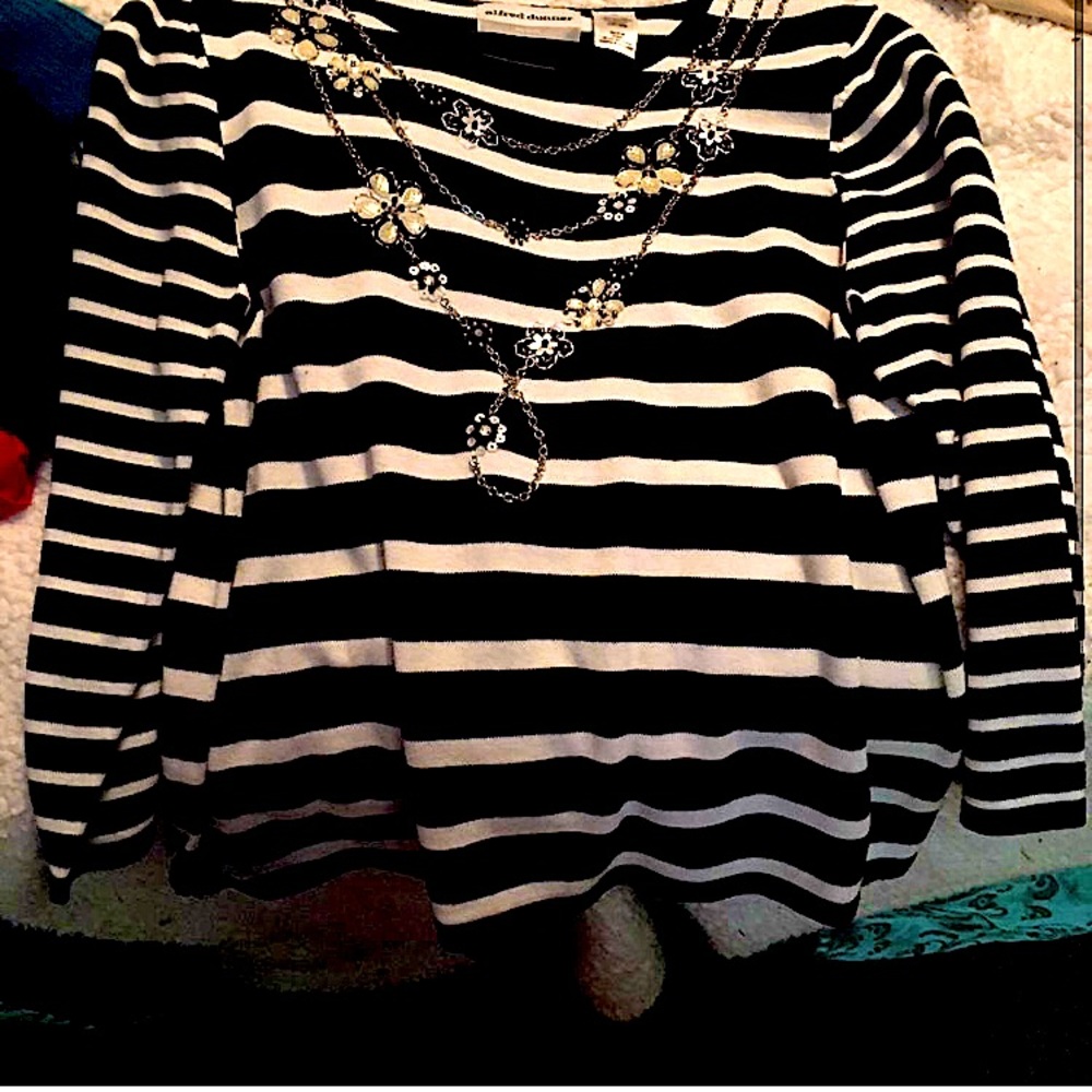 Black and white stripped shirt, with chain connected flowery designs.